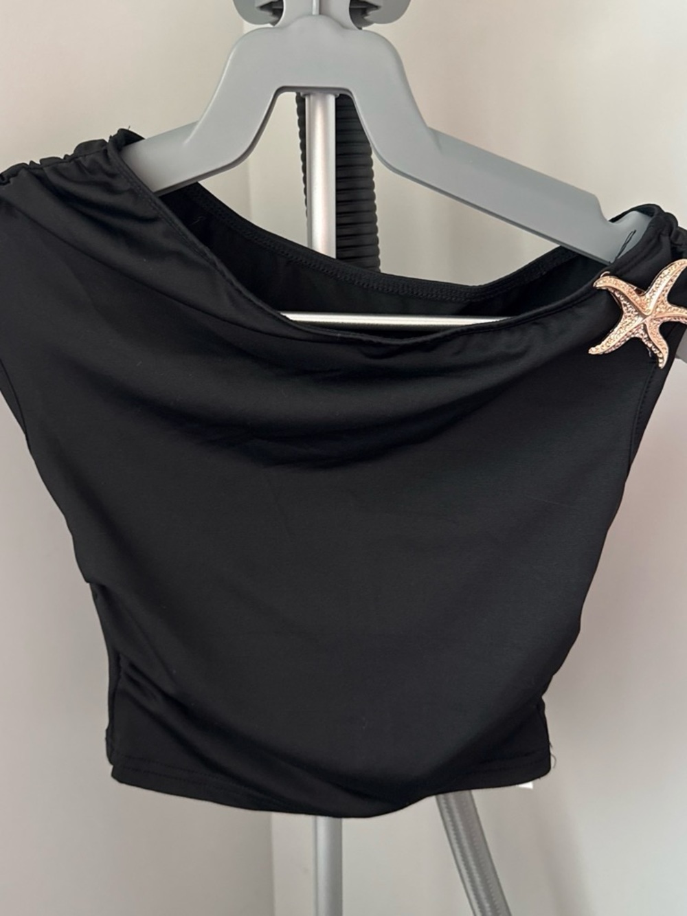 Black One-Shoulder Women's Top with Decorative Starfish Accent